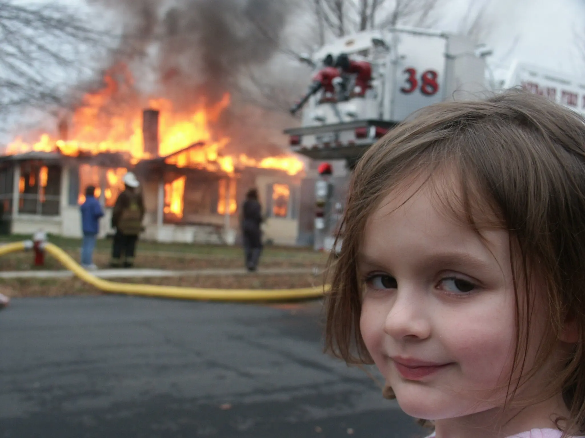 Photo of the famous disaster girl meme.